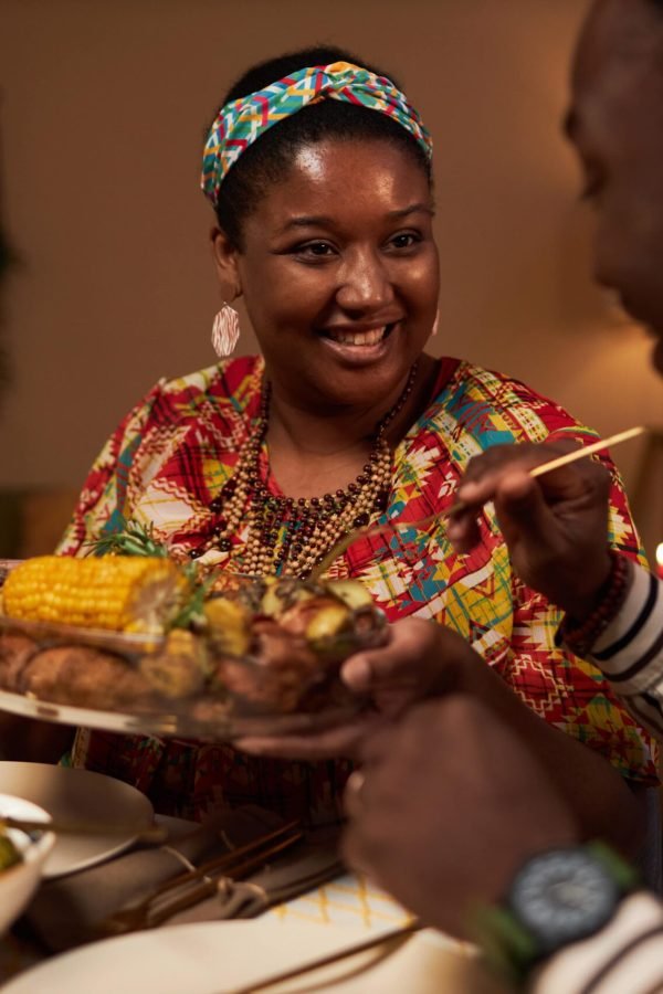 woman-offering-dish-to-husband-2023-11-27-05-24-17-utc-min